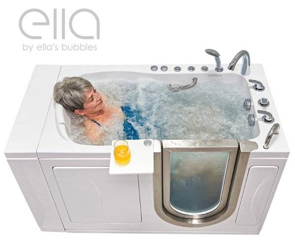 Senior woman relaxing in an Ella’s Bubbles walk in bathtub filled with bubbling hydrotherapy water